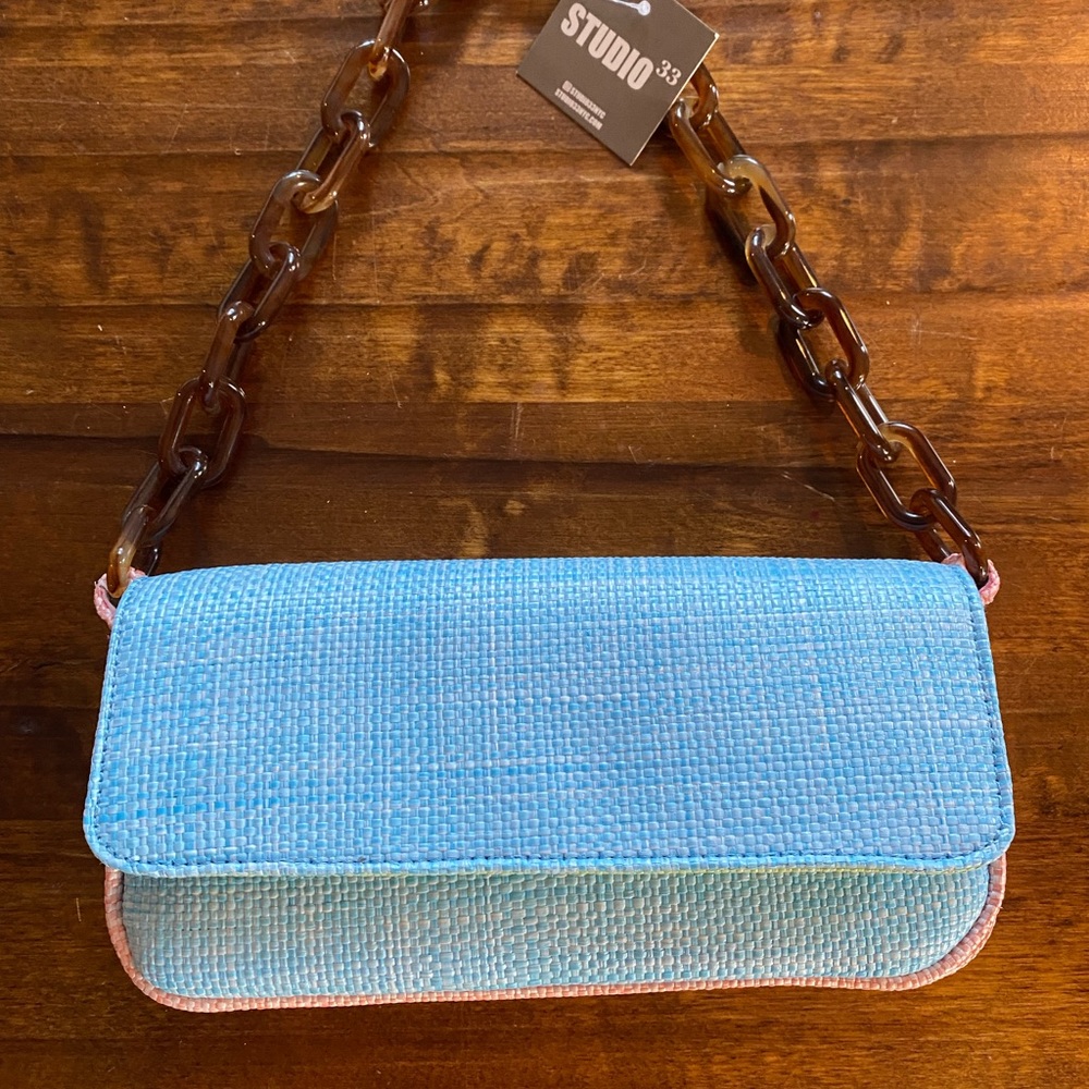 Studio 33 multi color purse with chain strap.